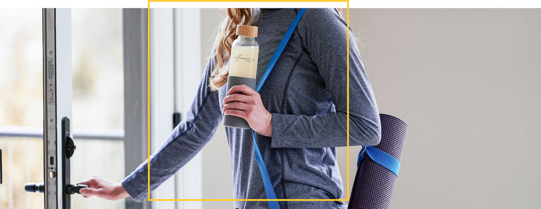 Woman leaving gym with an elemental diets drink