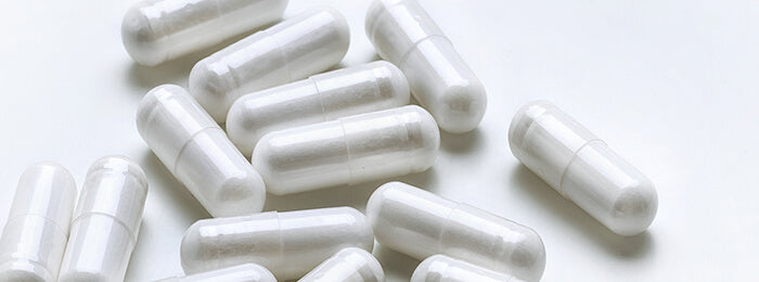 White supplement capsules